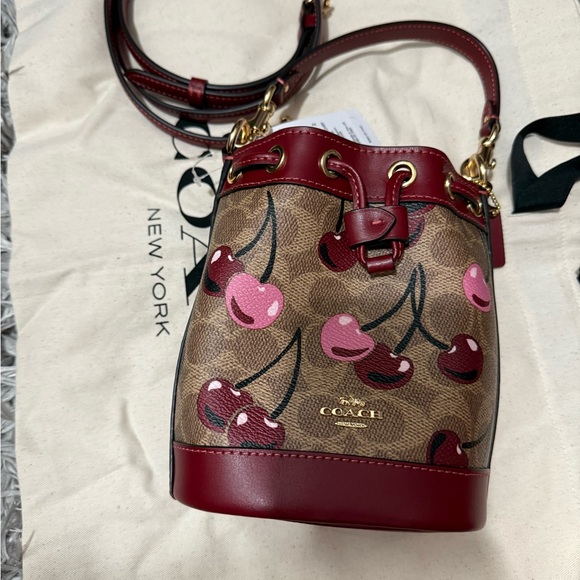 Coach Handbags - Coach Cherry signature mini bucket bag